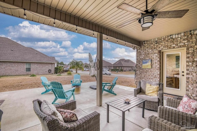 view of patio with outdoor lounge area and ceiling fan