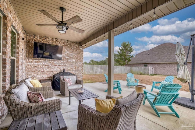 view of patio featuring ceiling fan and an outdoor living space