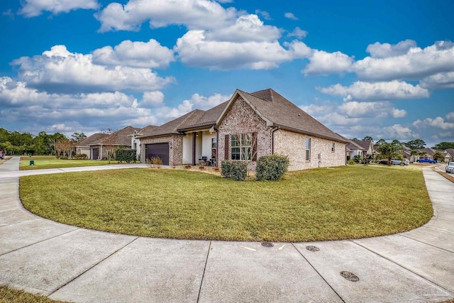 view of side of property featuring a garage and a yard