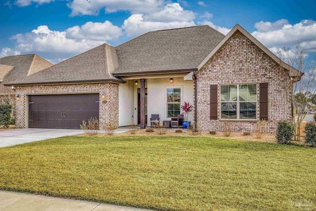 view of front facade with a garage and a front yard