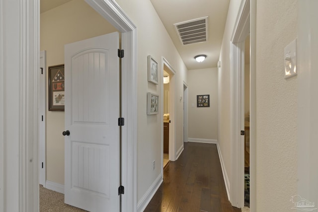 corridor featuring dark hardwood / wood-style floors