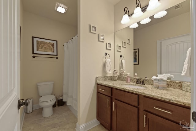 bathroom with vanity, a shower with shower curtain, and toilet