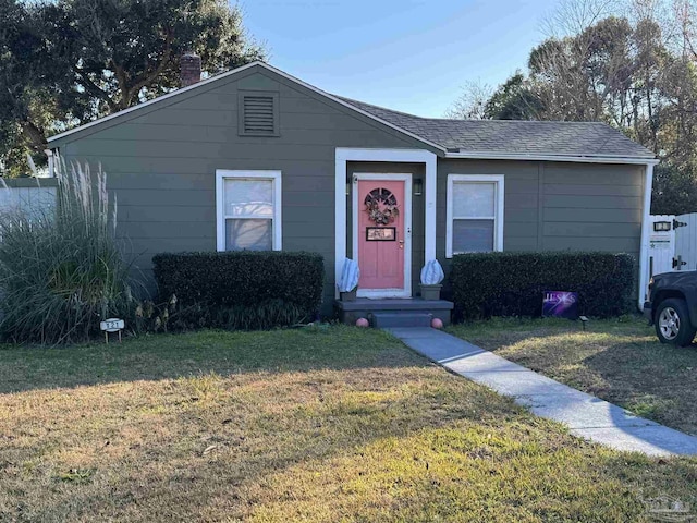 ranch-style home with a front yard