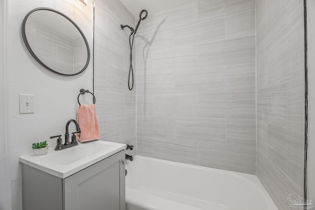 full bath featuring vanity and bathtub / shower combination