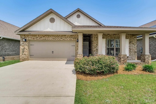 7926 Burnside Loop, Pensacola, FL 32526 - view of front of property featuring brick siding, board and batten siding, driveway, a porch, and an attached garage