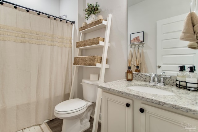 7926 Burnside Loop, Pensacola, FL 32526 - bathroom with vanity, toilet, wood finished floors, and a shower with curtain