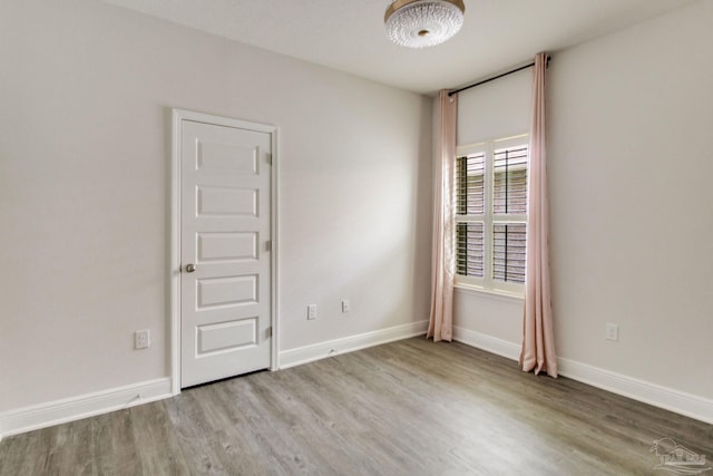 7926 Burnside Loop, Pensacola, FL 32526 - empty room with wood finished floors and baseboards