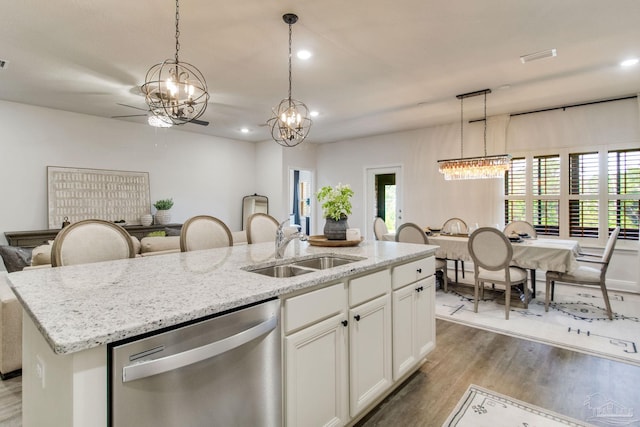 7926 Burnside Loop, Pensacola, FL 32526 - kitchen with dishwasher, a chandelier, wood finished floors, a sink, and a kitchen island with sink