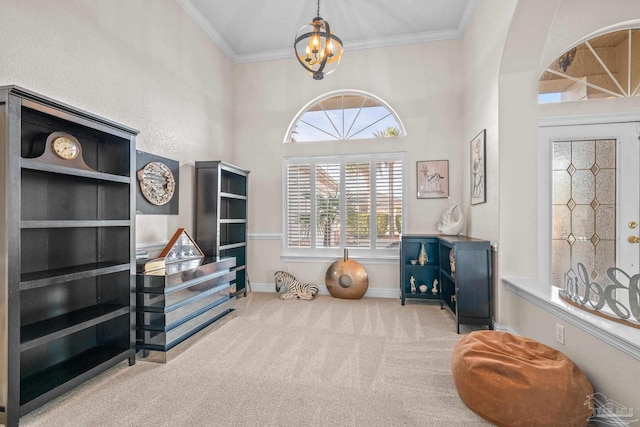 interior space featuring baseboards, arched walkways, carpet, crown molding, and a chandelier