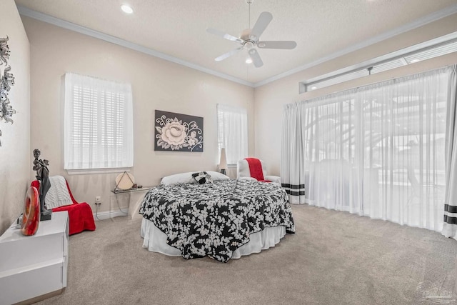 bedroom featuring carpet floors, crown molding, and a textured ceiling