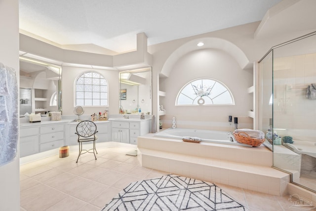 bathroom with tile patterned floors, a garden tub, vanity, and a shower stall