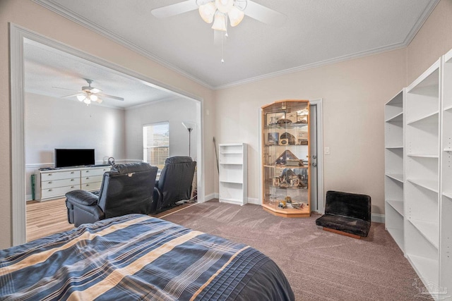 bedroom with a ceiling fan, carpet flooring, crown molding, and a textured ceiling