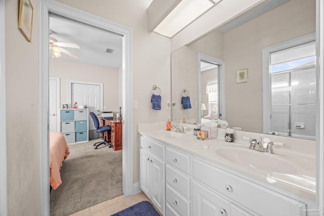 bathroom featuring double vanity, plenty of natural light, a sink, and visible vents