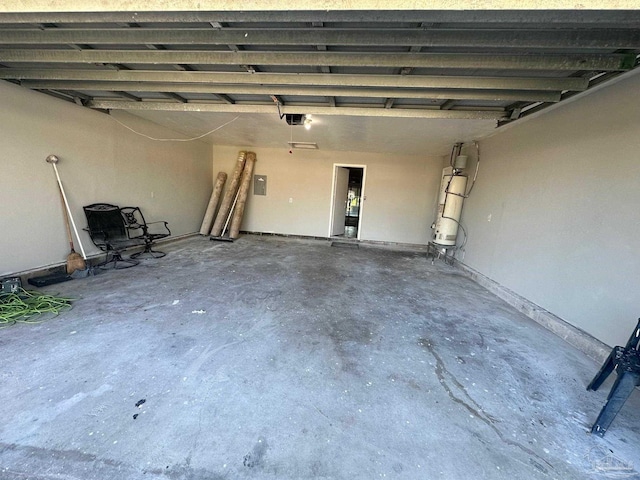 garage featuring a garage door opener and electric panel