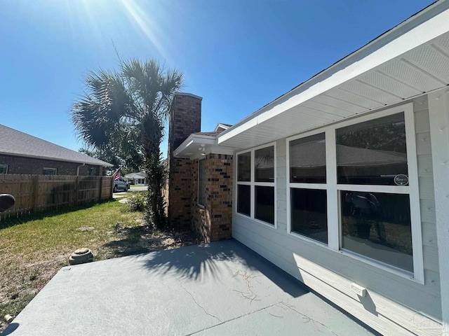 view of home's exterior featuring a yard and a patio area