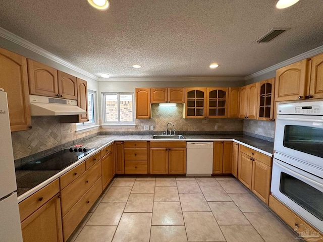 kitchen with sink, backsplash, ornamental molding, light tile patterned floors, and white appliances