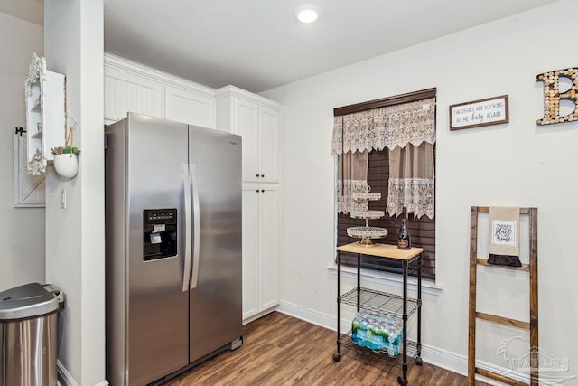 kitchen with white cabinetry, stainless steel refrigerator with ice dispenser, and hardwood / wood-style flooring