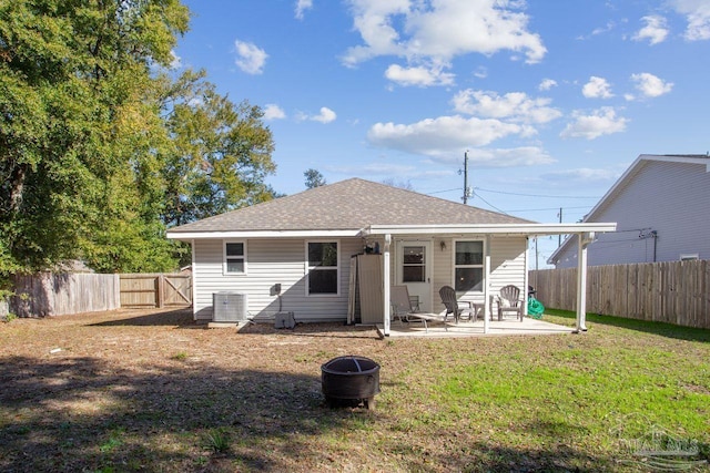 back of property featuring a patio area, a yard, and central AC unit