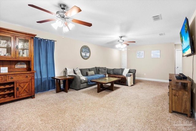 living room with ceiling fan and light carpet