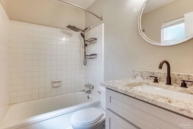 bathroom with vanity, toilet, and shower / bath combination