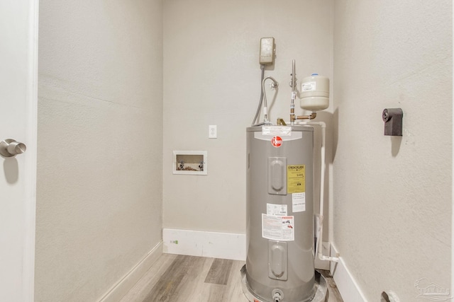 utility room featuring electric water heater