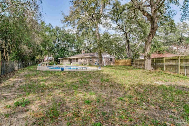 view of yard featuring a fenced backyard and a fenced in pool