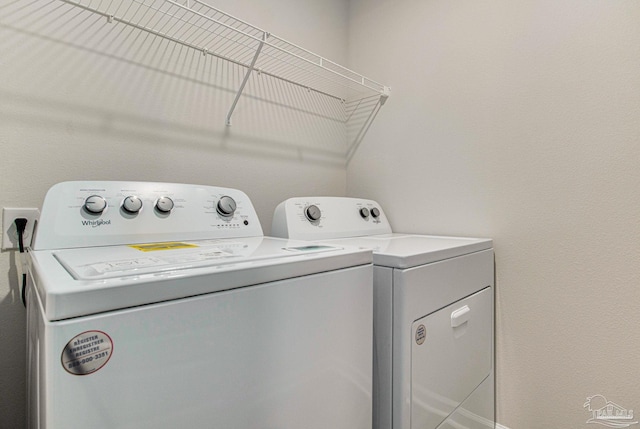 washroom featuring washer and clothes dryer