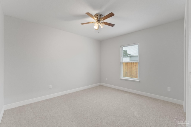 spare room featuring ceiling fan and carpet floors