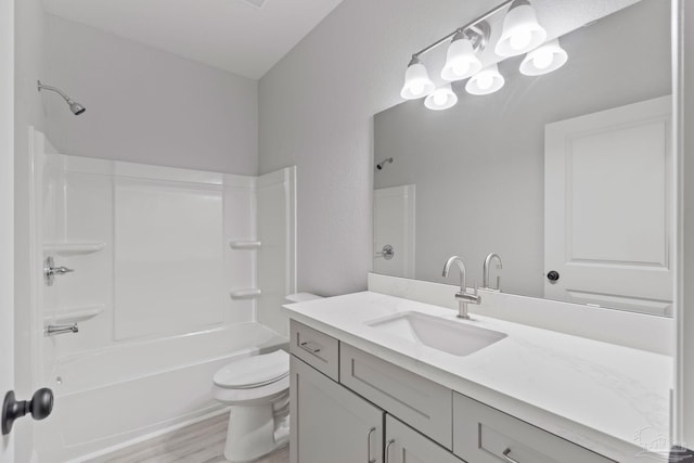 full bathroom with shower / bathing tub combination, vanity, toilet, and wood-type flooring