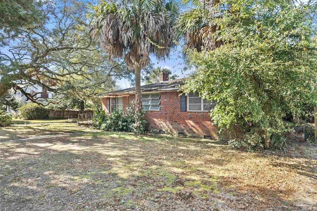 view of home's exterior featuring a yard