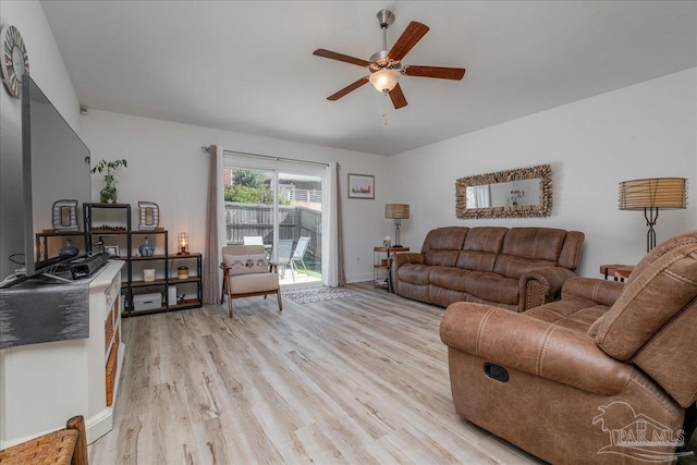 living room with ceiling fan and light hardwood / wood-style floors