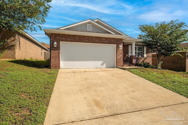 view of front of house with a garage and a front lawn