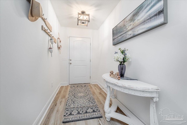 doorway to outside with light hardwood / wood-style flooring