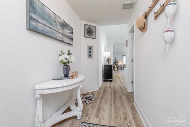 corridor featuring light hardwood / wood-style floors