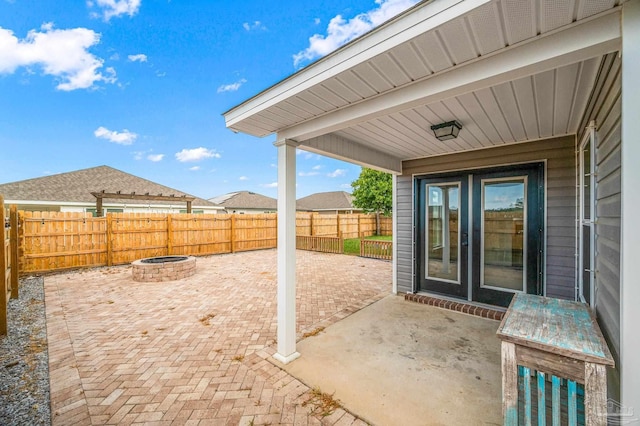 view of patio with a fire pit and a fenced backyard