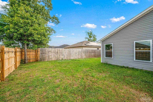 view of yard featuring a fenced backyard