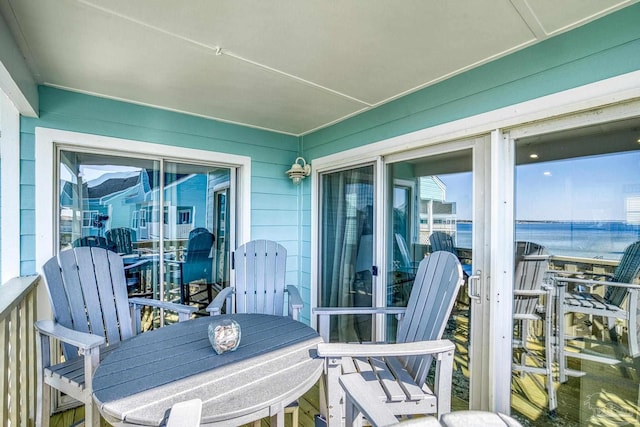 balcony featuring a water view