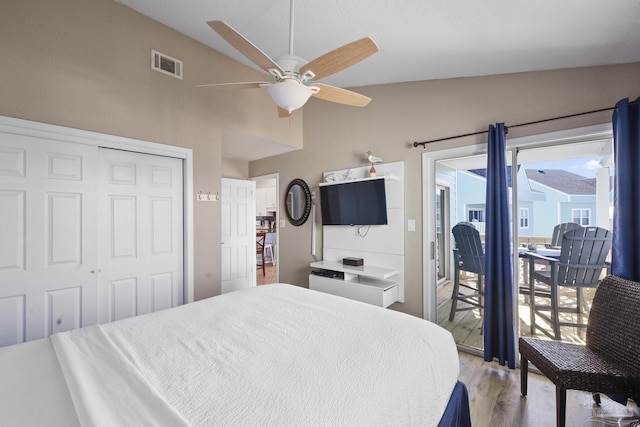 bedroom with access to outside, a closet, ceiling fan, and vaulted ceiling