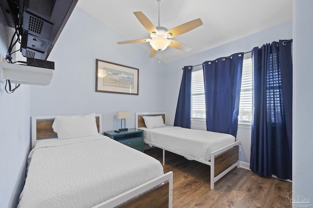 bedroom featuring lofted ceiling, dark hardwood / wood-style floors, and ceiling fan