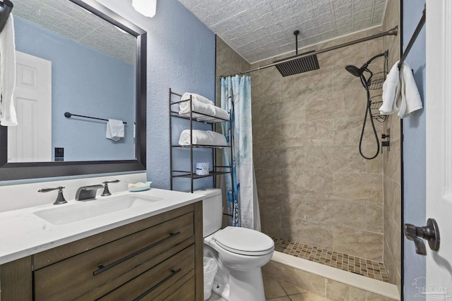 bathroom featuring vanity, toilet, curtained shower, and tile patterned flooring