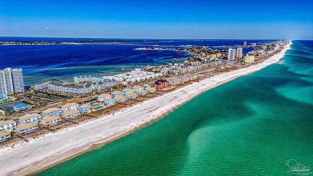 drone / aerial view with a water view and a view of the beach