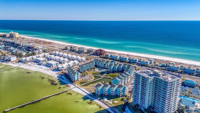 bird's eye view with a water view and a view of the beach