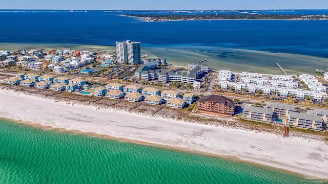 birds eye view of property featuring a water view and a view of the beach