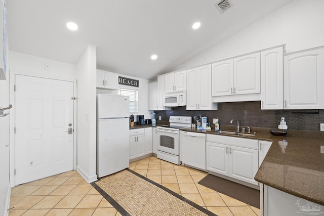 kitchen with white cabinetry, sink, white appliances, and vaulted ceiling