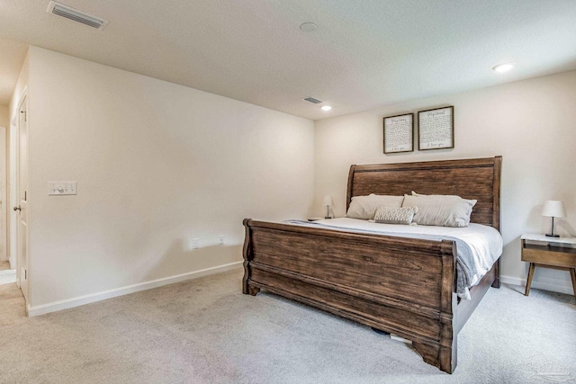 bedroom featuring light carpet