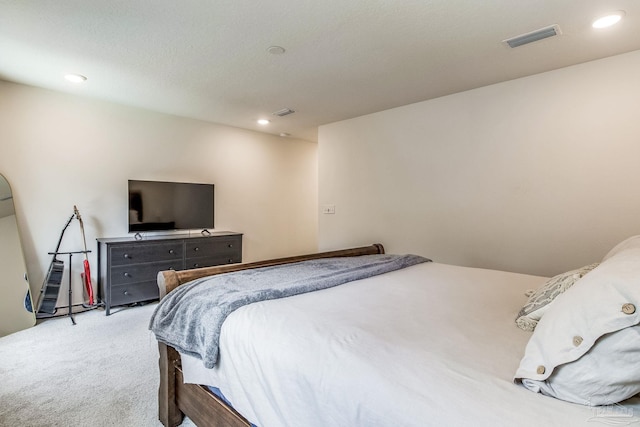 bedroom featuring light colored carpet