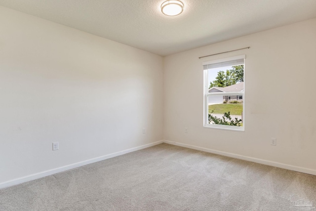 4642 Perception Cir, Milton, FL 32570 - empty room with light carpet, baseboards, and a textured ceiling