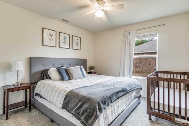 bedroom featuring ceiling fan and carpet flooring