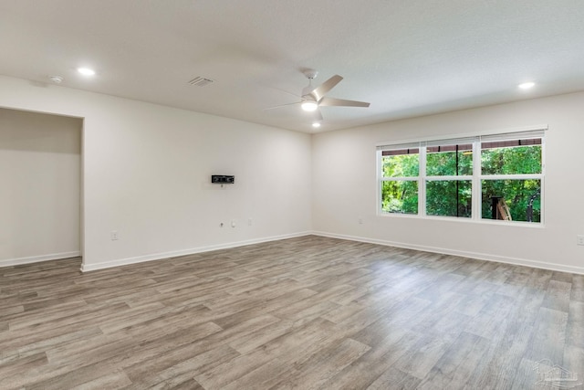 4642 Perception Cir, Milton, FL 32570 - empty room with a ceiling fan, wood finished floors, recessed lighting, and baseboards