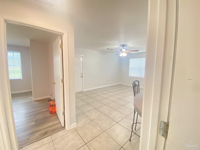 unfurnished room with ceiling fan and light hardwood / wood-style flooring